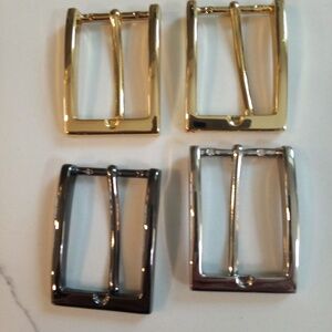 FOUR BELT BUCKLES